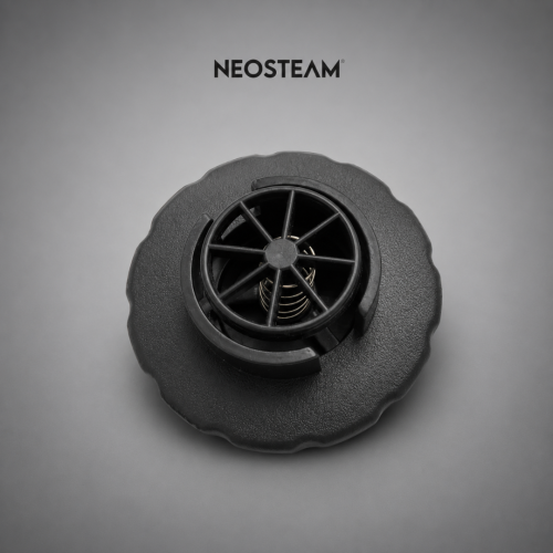 Close-up of a black textured circular component with a spoked inner ring and visible spring, NEOSTEAM logo above.