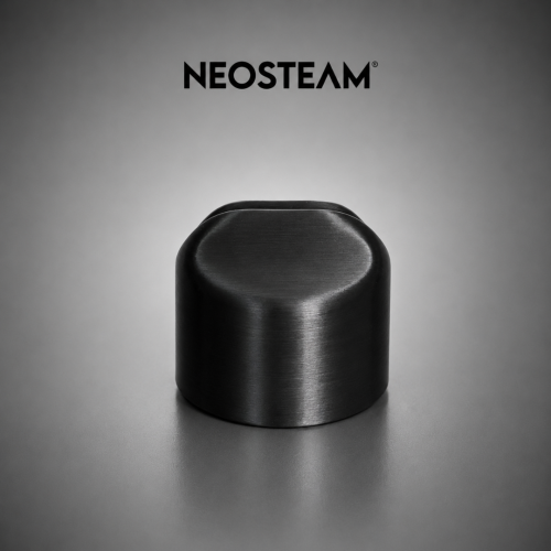 92 - NeoSteam Black brushed metal cylindrical knob on a gray surface with the Neostem logo above.