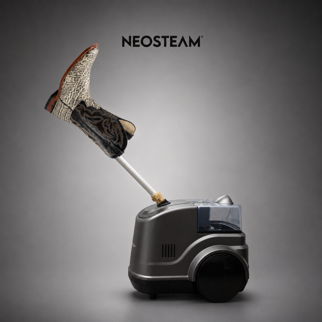 18 1 - NeoSteam Boots are attached to a long wand feeding into a sleek gray Neosteam cleaning unit, suggesting a boot-sterilizing or steam-shoe technology setup.