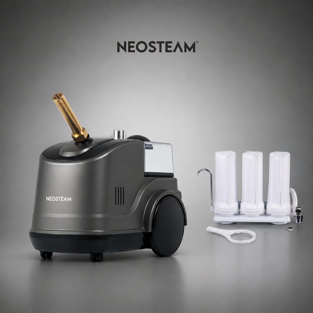 15 - NeoSteam NEOSTEAM device with a gold-toned wand and a cartridge-filter accessory kit beside it against a gray backdrop.