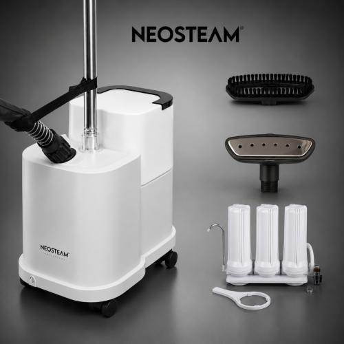 Neosteam professional steam cleaning system with a tall chrome wand attached to a white wheeled base and an assortment of accessories nearby (brush, filters, and fittings).