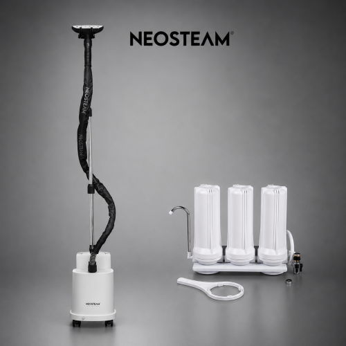 image - NeoSteam Neosteam professional steam device with a tall vertical wand and three white cylinder modules on a base, set against a gray backdrop.