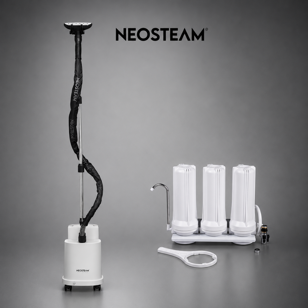 image - NeoSteam Neosteam professional steam device with a tall vertical wand and three white cylinder modules on a base, set against a gray backdrop.