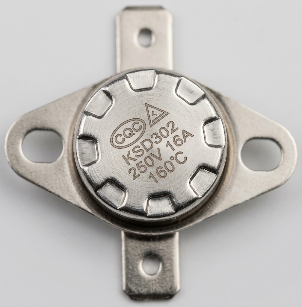 watermarked_img_6137718486359336559 - NeoSteam Close-up of a silver KSD302 thermal cutoff with mounting tabs, labeled 250V 16A 160°C.